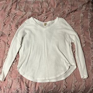 This is a white sweater not heavy, nice for a simple chilly day. It’s very comfy